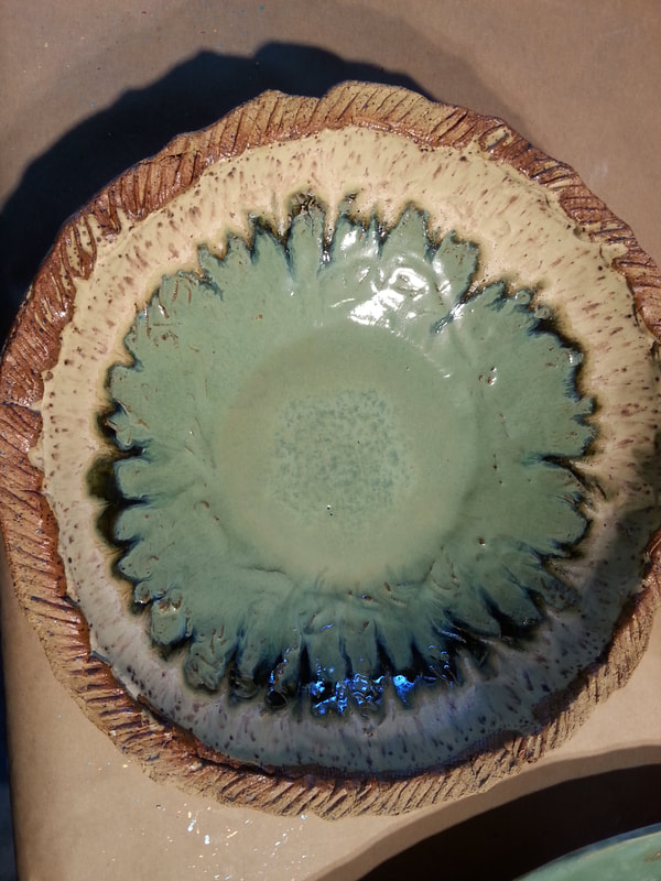 Glazed bowl, showing the effect of the clay texture on the final glazed design. Linda Levy's handbuilt plates and platters use her hand-created ceramic rollers to impart designs & textures on her ceramics, ceramicist, ceramic art, sculpture, and ceramic sculpture.