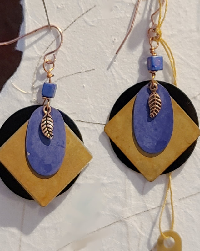Small copper feather - Linda Levy has been creating Jewelry, Necklaces, Earrings, Gemstone jewelry, handcrafted, original art, in Santa Cruz California
