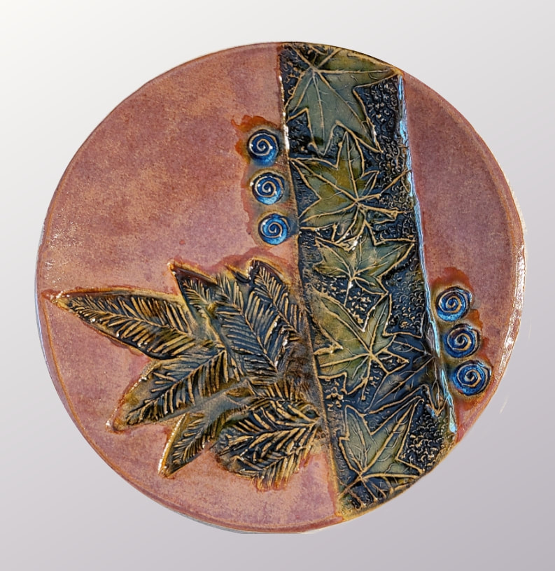 Maple & Redwood Leaves Plate, Ceramics: Clay has called to Linda Levy - LA Levy - Linda A. Levy for over 50 years.  She has learned wheel throwing techniques, handbuilding, as well as glaze chemistry.  Her latest sculptural works are inspired by working with live models.  Linda's handbuilt plates and platters usually use her hand-created ceramic rollers to impart designs & textures.